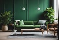 a room with green walls and sofas and table in the middle