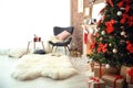 Room interior with Christmas tree and gifts near decorative fireplace Royalty Free Stock Photo