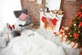 Room interior with Christmas tree and gifts near decorative fireplace Royalty Free Stock Photo