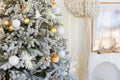 room interior with Christmas tree decorated with golden balls toys on blurred, sparkling and fabulous fairy tale background with Royalty Free Stock Photo