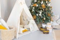 room interior with Christmas tree decorated with golden balls toys on blurred, sparkling and fabulous fairy tale background with Royalty Free Stock Photo