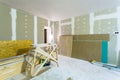 Materials for construction - putty packs, sheets of plasterboard or drywall- in apartment is under construction Royalty Free Stock Photo
