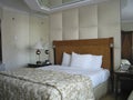 Room with king-size bed and on ceiling mirror