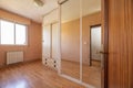 Room with mirror sliding door wardrobe and glass and aluminum leaf window