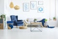 Room with navy blue armchair