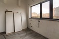 Room in new house under construction. Laminate floor, plastered wall, new electrical wiring.