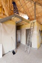 A room at a newly constructed home is sprayed with liquid insulating foam. Royalty Free Stock Photo