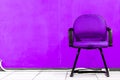 Room in office or home with modern chair and purple wall background Royalty Free Stock Photo