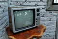 A room with an old iron chair and television Royalty Free Stock Photo