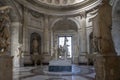 A room in one of the museums in Vatican City, Rome, with several marble statues of people and in the center a marble statue of a c Royalty Free Stock Photo