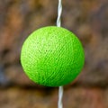 Room ornamented with a green color silk cover light bulb. Royalty Free Stock Photo