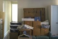 Room with packed household stuff in cardboard boxes for moving into a new home Royalty Free Stock Photo