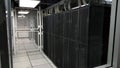 Room with rows of server hardware in the data center