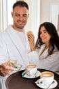 Room service delivering coffee to a hotel room for married couple wearing bathrobe who is giving dollar tips Royalty Free Stock Photo