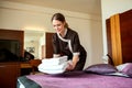 Room service maid bringing fresh new towels Royalty Free Stock Photo