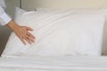 Room service maid cleaning and making bed hotel room concept, female hands of chambermaid making bed in hotel room Royalty Free Stock Photo