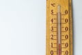 room thermometer on a wooden base close up on a white background. Celsius degree scale Royalty Free Stock Photo