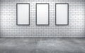 Room with three blank frames on white wall Royalty Free Stock Photo