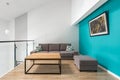 Small living room with turquoise wall