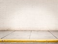 Room with white bricks wall and grey cement floor Royalty Free Stock Photo