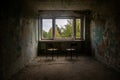 A room with a window and chairs in an old abandoned house. Dirty shabby walls.