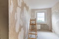 Room with a wooden ladder in a flat in renovation