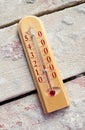 Room wooden thermometer on boards with cement Royalty Free Stock Photo