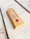 Room wooden thermometer on boards with cement Royalty Free Stock Photo