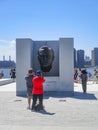 Roosevelt Island, New York: Visitors take pictures of the FDR sculpture at Four Freedoms Park