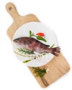 Rooster hind grouper or Pink Grouper decorated on a white plate.Selective focus