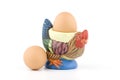 Rooster shaped egg holder with eggs Royalty Free Stock Photo