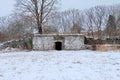Root Cellar and Stone Wall in Winter Royalty Free Stock Photo