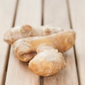 Root ginger on wooden table