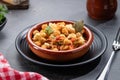 Ropa vieja, typical Canarian dish of chickpeas stew with chicken and potatoes in a earthenware casserole Royalty Free Stock Photo