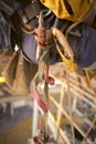 Rope access equipment descender leg loop hanging on the side of inspector abseiler safety harness loop