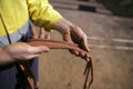 Rope access technician inspector male hand inspecting 10.5 mm low stretch cow tail secondary safety back rope