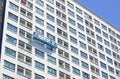 Rope access workers painting the facade of a high building Royalty Free Stock Photo