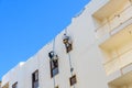 Rope access workers on a residential building in Hurghada, Egypt Royalty Free Stock Photo