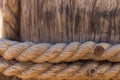Rope around wood pillar nautical ship object, wooden background texture