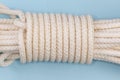 Rope bight with Alpine coil knot on a blue background