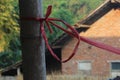 A rope that binds wood against the background of the building