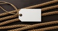 Rope with Blank White Tag on Dark Background for Nautical or Maritime Theme Royalty Free Stock Photo