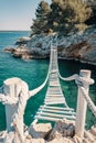 Rope bridge over a cliff in Punta Christo, Pula, Croatia - Europe. Travel photography, perfect for magazines and travel