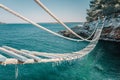 Rope bridge over a cliff in Punta Christo, Pula, Croatia - Europe. Travel photography, perfect for magazines and travel
