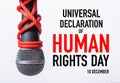 Rope and chain on fist hand with world HUMAN RIGHTS DAY 10 DECEMBER text Royalty Free Stock Photo