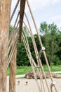 Rope climbing net at playground. Modern kids playground made from natural materials