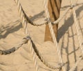 Rope climbing net at playground. Modern kids playground made from natural materials