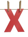 Rope with clothespin and letter x