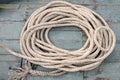 Rope coil on aged wooden boat. Top view Royalty Free Stock Photo