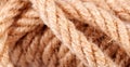 Rope coil macro, closeup, abstract background texture. Tangled tied brown natural organic ecological strong rope simple rough